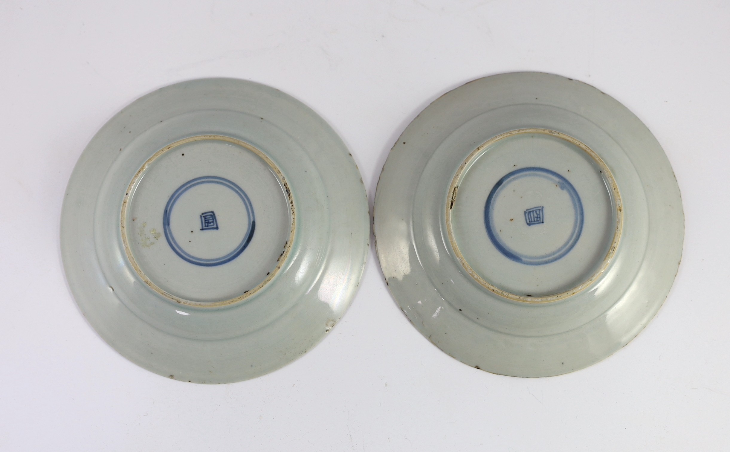 A pair of Chinese famille rose fencai small plates, early Yongzheng period, 16 cms diameter, 16cm diameter